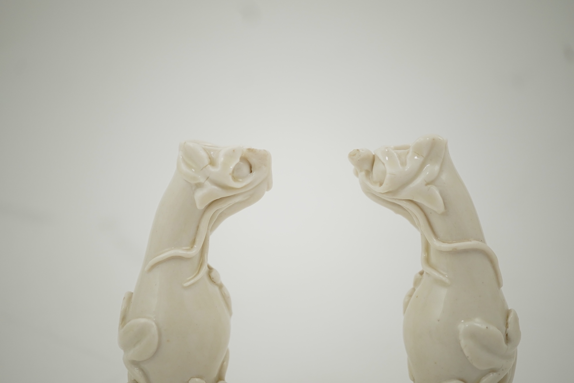 A pair of Chinese blanc-de-chine gourd-shaped vases, Dehua kilns, Qing dynasty
